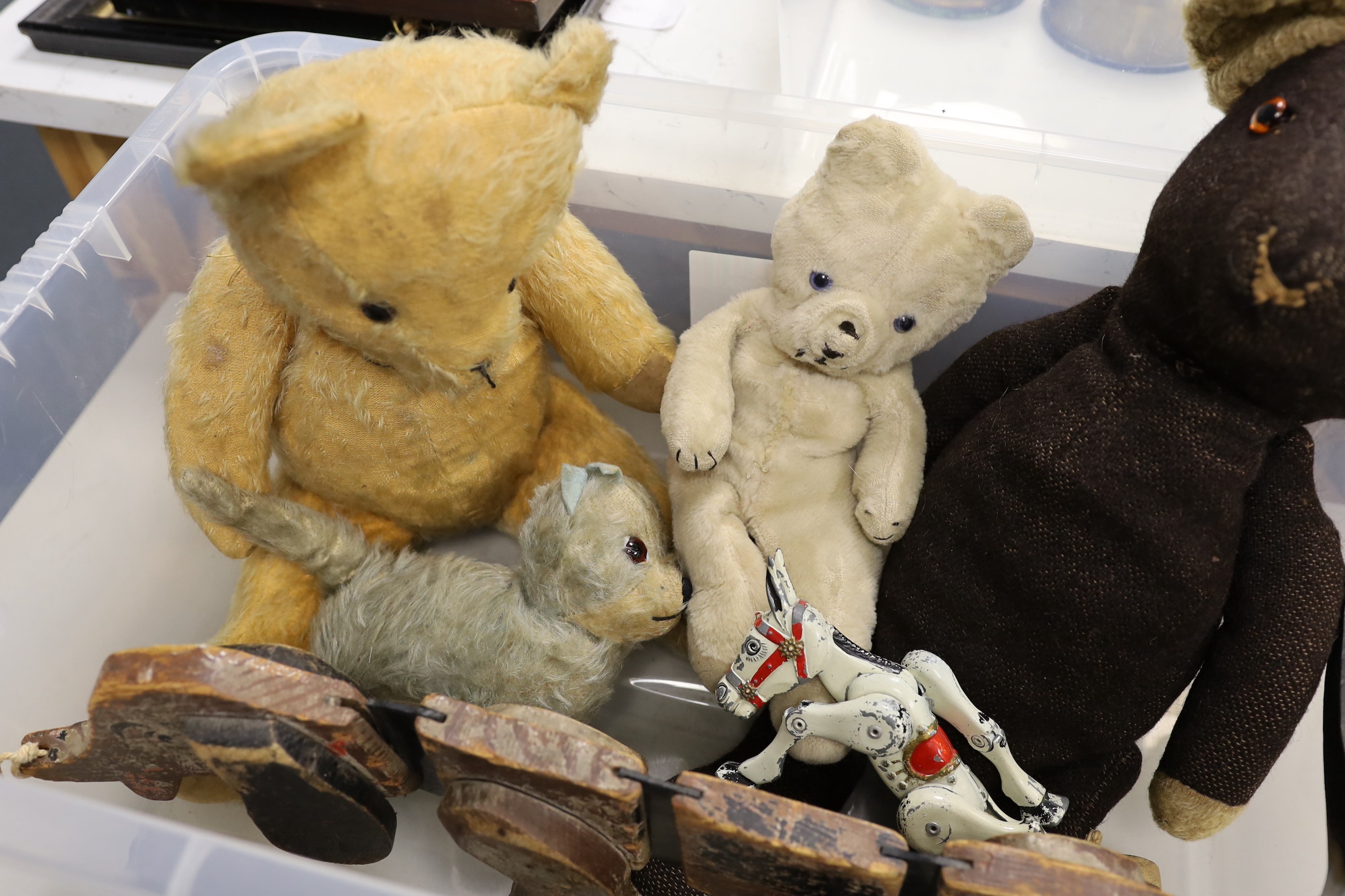 A selection of various early to mid 20th century teddy bears and toys, to include a Tri pulling wooden sausage dog